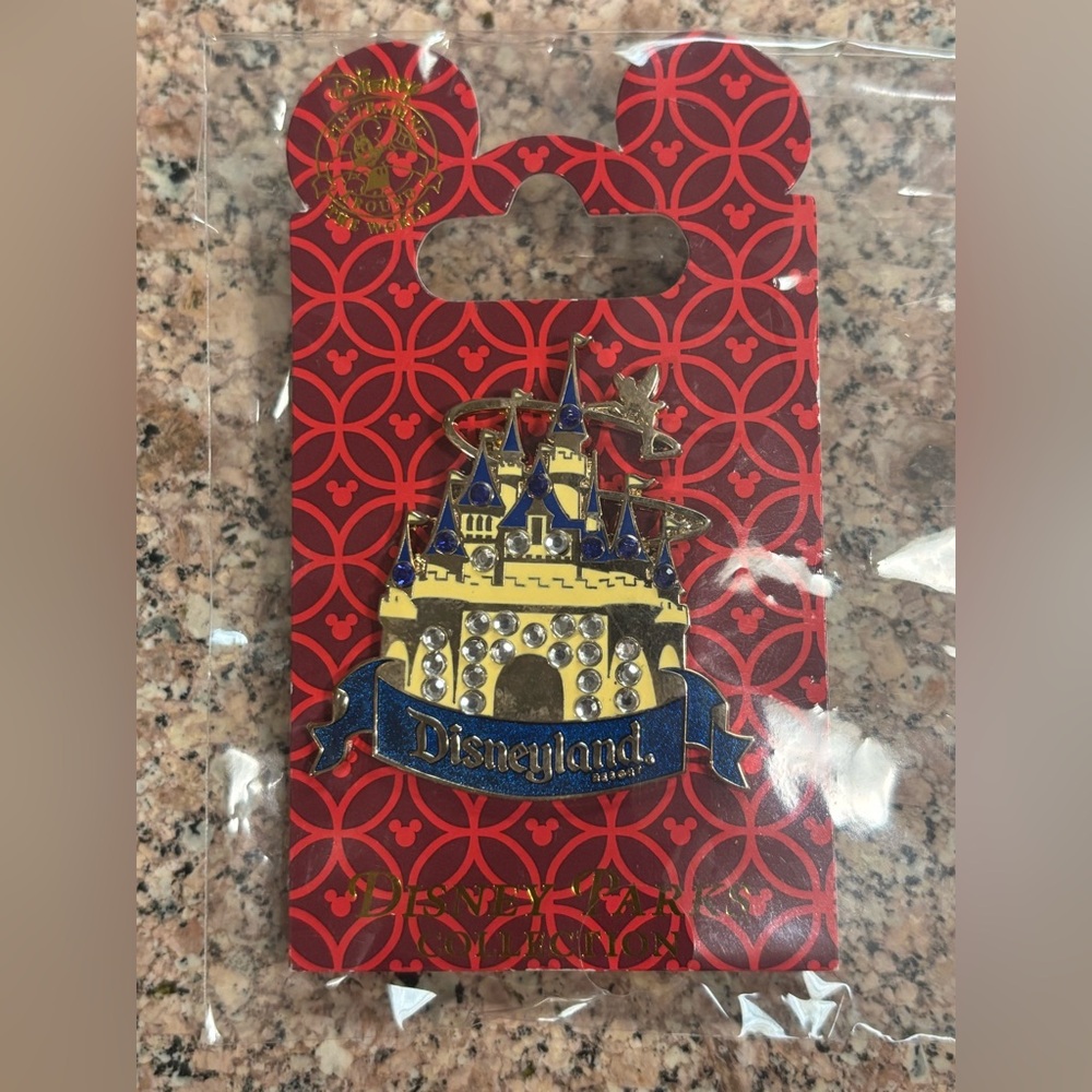 Disneyland Sleeping Beauty Castle with a blue banner Trading Pin
